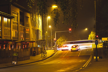 Late night traffic waits at a junction