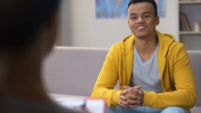 Afro-American teenager visiting psychotherapist, successful problems overcoming