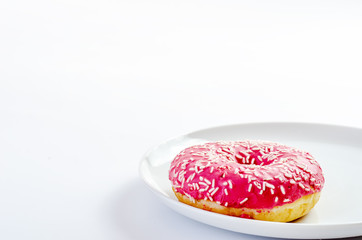 multi-colored donuts on a white background
