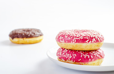 multi-colored donuts on a white background
