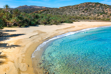 Scenic landscape of palm trees, turquoise water and tropical beach, Vai, Crete, Greece.