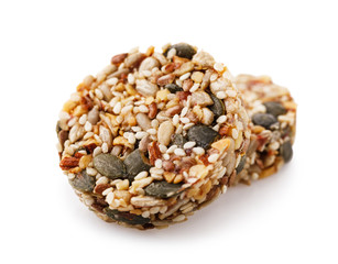Tasty and healthy dessert made of different nuts and dried fruit seeds isolated on white background