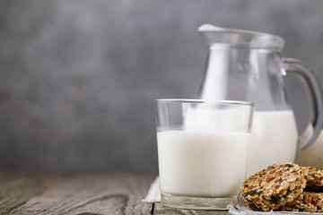 Glass of milk with a healthy dessert that includes dry fruit and a variety of seeds with copy space
