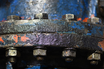 Big screws connecting two pipelines.