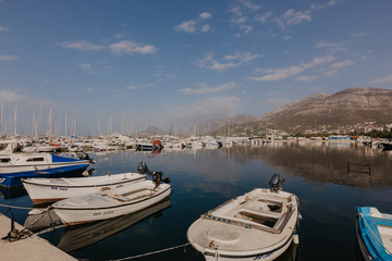 Fototapeta na wymiar Bar, Montenegro - November 31, 2018. fishing boats on the background of mountains and yachts on the Adriatic coast. - Image.