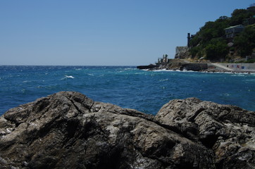 Large stones of frozen lava on the beach in Foros, Crimea.