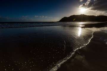 Lonely Beach at sunrise Waikawau Bay campsite, Coromandel, New Zealand