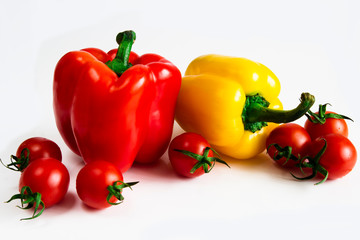 Bulgarian pepper with tomatoes on a white background