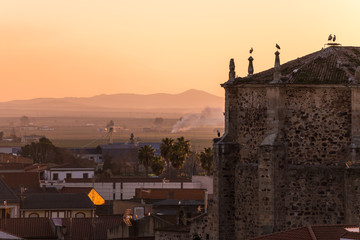 Sunset views of the church of Santa Cecilia and the town of Medellin