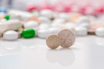 Pills and tablets as medical background. Close-up.