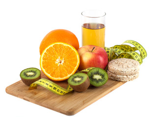 Fototapeta na wymiar fruits, eggs, orange, apple juice on the wooden board with measurement isolated on white