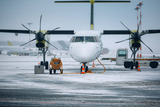 Modern airplane near terminal