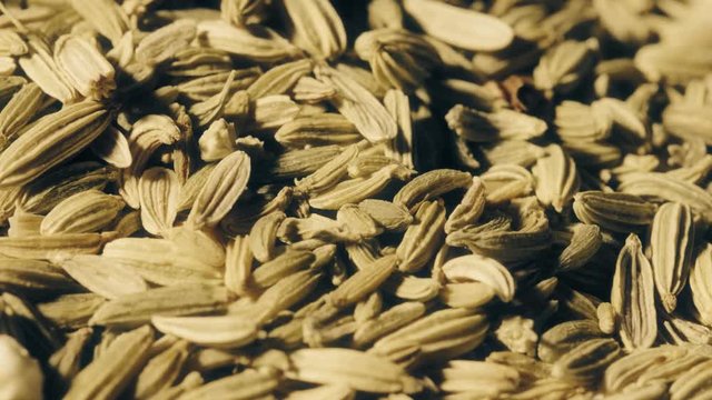Pile of cumin seeds macro shot