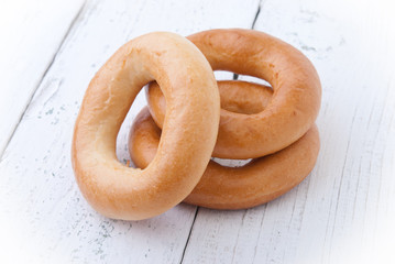 Big bagels on wooden background