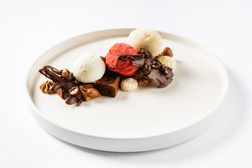 brownie with ice cream on the white plate