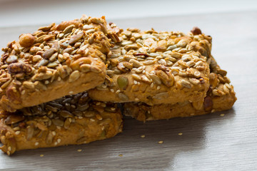 butter biscuits with nuts and cereals. Close-up. Concept: healthy food, breakfast, seeds. soft focus.