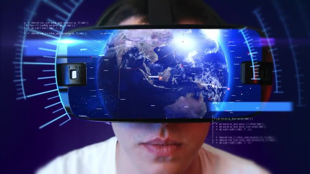 Young man wearing VR headset and experiencing virtual reality. Technology related digital earth network concept. Seamless Loop.