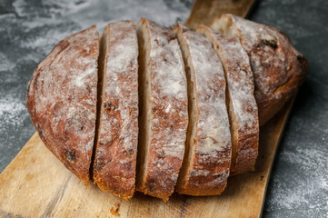 Traditional italian ciabatta on a wooden cutting board. Close-up