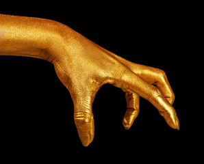Hand gesture. Hand in gold paint, shiny, metallic. Isolated on black background.
