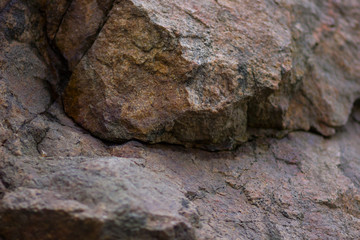 Granite rocks with blurred background. Granite close up. Texture of the stone. Natural material background