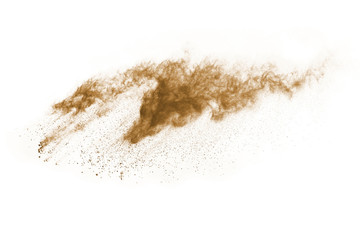 Brown color powder explosion on white background. Colored cloud. Colorful dust explode. Paint Holi.