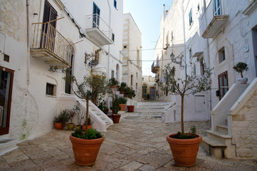 OSTUNI, APULIA, ITALY - MARCH 28th, 2018: Typical street of Ostuni, La Citta Bianca. Ostuni. Apulia, Italy