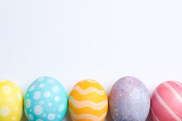 Decorative Easter eggs on white background, space for text. Top view