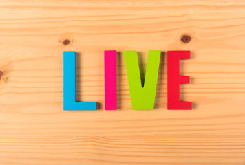 Text live on wooden background