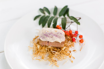 Fresh cooked tuna with sauce and berries on plate. Seafood, healthy lifestyle concept