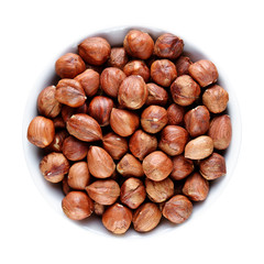 Hazelnuts in bowl isolated on white background