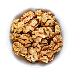 Walnuts in bowl isolated on white background