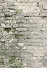Old grey brick wall with broken fragments, background, warm colors edit. vertical with copy space