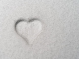 Heart shape in the freshly fallen snow with copy space.