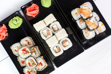 Sushi and rolls on black plate. Sea healthy japanese asian food