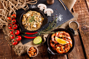 Fried large shrimp in tomato sauce with olive oil,Mushrooms in cream sauce, julienne, champignon, products for cooking
