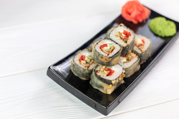 Sushi and rolls on black plate. Sea healthy japanese asian food