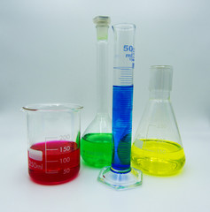 Set of different glass labware, white background