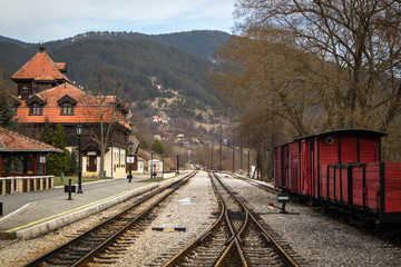 Fototapeta na wymiar Old railroad station with narrow gauge railway track, popular tourist attraction known as sarganska osmica in Mokra Gora village in Serbia.