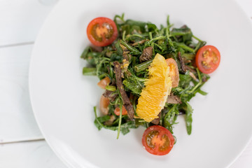 Fresh green salat with tomatoes, spinach and arugula