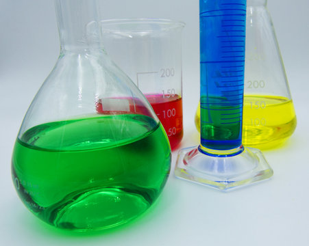 Set of different glass labware, white background