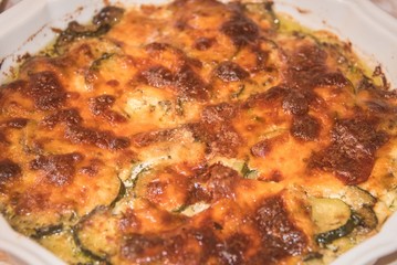 Obraz na płótnie Canvas Traditional Italian cuisine - baked zucchini.
