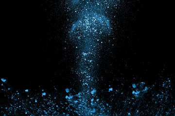 Blue powder explosion on black background. Colored cloud. Colorful dust explode. Paint Holi.