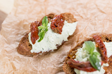 Bruschetta with cheese cream and tomatoes