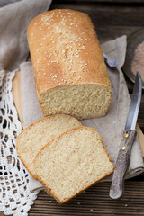 Loaf of white bran bread with sesame seeds