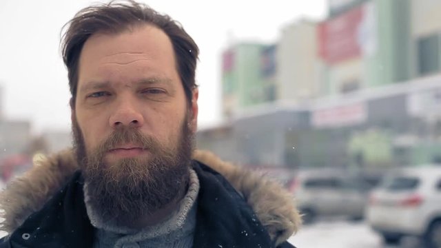 portrait of a man with a beard on a winter day