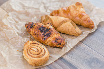 Fresh croissants on paper 