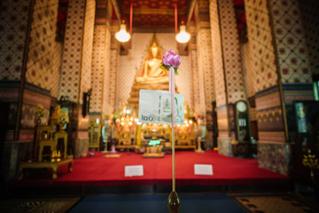 Fototapeta na wymiar inside a Buddhist temple with golden statues