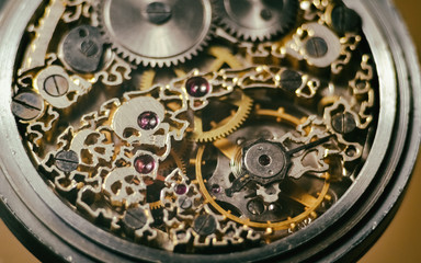 Fototapeta na wymiar Skeleton of vintage handmade antique mechanical pocket watches, clockwork old mechanical watch, high resolution and detail, winter time and summer time concept. selective focus.