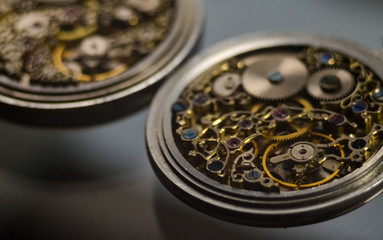 Skeleton of vintage handmade antique mechanical pocket watches, clockwork old mechanical watch, high resolution and detail, winter time and summer time concept. selective focus.