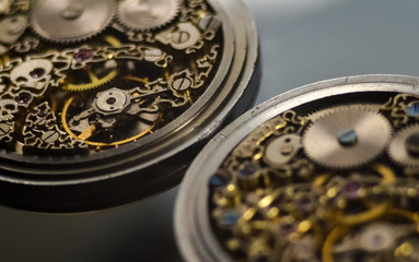 Skeleton of vintage handmade antique mechanical pocket watches, clockwork old mechanical watch, high resolution and detail, winter time and summer time concept. selective focus.